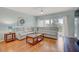 Comfortable living room features a large sectional sofa and access to a private balcony at 960 Starkey Rd # 2405, Largo, FL 33771