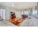 Open-concept living space features a large television and access to the dining room and kitchen at 960 Starkey Rd # 2405, Largo, FL 33771