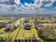 Aerial view of community featuring neatly aligned homes and long manicured lawns at 9814 Palazzo St, Seffner, FL 33584