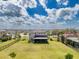 Expansive backyard with green lawn and fenced perimeter, perfect for outdoor activities and privacy at 9814 Palazzo St, Seffner, FL 33584