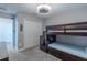 Bedroom with carpet flooring and a wooden bunkbed against the wall at 9814 Palazzo St, Seffner, FL 33584