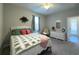 Comfortable bedroom with neutral walls, carpet flooring, and a cozy decor at 9814 Palazzo St, Seffner, FL 33584