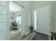 Welcoming entryway with an adjacent home office space visible through decorative glass doors at 9814 Palazzo St, Seffner, FL 33584
