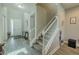 Bright entryway features stairs, a decorative door, and elegant decor at 9814 Palazzo St, Seffner, FL 33584