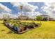 Established garden with a variety of plants and vegetables, perfect for gardening enthusiasts at 9814 Palazzo St, Seffner, FL 33584