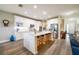 Spacious kitchen with a large island, modern appliances, ample cabinet space, and stylish countertops at 9814 Palazzo St, Seffner, FL 33584