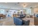Open-concept living space with a modern kitchen and inviting seating area under a fan at 9814 Palazzo St, Seffner, FL 33584