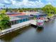 Aerial view of the screened-in pool and boat lift on the canal at 9909 San Mateo Way, Port Richey, FL 34668