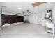 Spacious garage showcasing bikes, a sink, and plenty of space for cars or storage at 9909 San Mateo Way, Port Richey, FL 34668