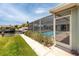 Screened-in pool with patio access, overlooking the canal and boat lift at 9909 San Mateo Way, Port Richey, FL 34668