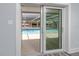 Sliding glass doors opening to the pool and patio at 9909 San Mateo Way, Port Richey, FL 34668