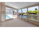 Enclosed porch with waterfront views of boats and the canal, perfect for entertaining at 9909 San Mateo Way, Port Richey, FL 34668