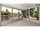 Waterfront porch with views of the canal, offering a serene outdoor space at 9909 San Mateo Way, Port Richey, FL 34668