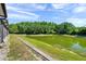 Exterior view of backyard featuring pond and green vegetation at 10217 Westpark Preserve Blvd, Tampa, FL 33625