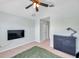 Cozy bedroom with a ceiling fan, light blue walls, neutral carpet, and dark furniture for a relaxed aesthetic at 10217 Westpark Preserve Blvd, Tampa, FL 33625
