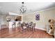 Dining area with hardwood floors, pendant lighting, adjacent to the kitchen, and view of the outdoors at 10217 Westpark Preserve Blvd, Tampa, FL 33625