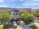 Charming townhome with well-maintained landscaping, two car garage, and a gray exterior paint at 10217 Westpark Preserve Blvd, Tampa, FL 33625
