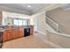 Spacious kitchen featuring wooden cabinets, granite countertops, black appliances, and tile flooring at 10217 Westpark Preserve Blvd, Tampa, FL 33625