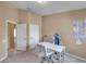 Clean office space with modern furniture, featuring view to bedroom and wall decor at 10217 Westpark Preserve Blvd, Tampa, FL 33625