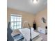 Bright home office with a modern desk, ergonomic chair, and ample natural light at 10217 Westpark Preserve Blvd, Tampa, FL 33625