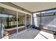 Enclosed outdoor patio featuring concrete floors and sliding glass doors offering pool views at 10217 Westpark Preserve Blvd, Tampa, FL 33625