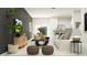 Beautifully decorated living room featuring modern furnishings and an open concept design to the kitchen at 10261 Trumpet Honeysuckle Way, San Antonio, FL 33576
