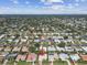 Drone's-eye view showing this property in a quiet neighborhood with mature landscaping at 10387 Majestic Dr, Largo, FL 33774