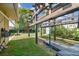 Backyard play structure, swing set and lush landscaping at 10387 Majestic Dr, Largo, FL 33774