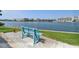 Scenic waterfront bench offers a peaceful retreat to enjoy tranquil views and serene surroundings at 10387 Majestic Dr, Largo, FL 33774