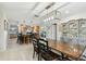 Open concept dining area featuring a wooden table and chairs, opening into the kitchen with a breakfast bar at 10387 Majestic Dr, Largo, FL 33774