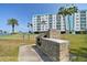 Community grill area with a built-in grill, ideal for outdoor cooking and social gatherings at 10387 Majestic Dr, Largo, FL 33774