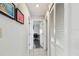 Hallway with tiled floor, closet space, and access to a bedroom at 10387 Majestic Dr, Largo, FL 33774