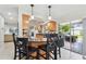 Eat-in kitchen with a bar, updated appliances, and an open concept to the living space at 10387 Majestic Dr, Largo, FL 33774