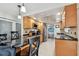 Modern kitchen featuring stainless steel appliances, a breakfast bar, and updated cabinets at 10387 Majestic Dr, Largo, FL 33774