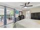Bright main bedroom with ensuite bathroom and access to a screened outdoor seating area at 10387 Majestic Dr, Largo, FL 33774