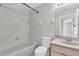 Clean bathroom with a bathtub, shower, and updated vanity at 11617 Colony Lake Dr, Tampa, FL 33635