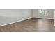 Bedroom featuring wood floors and natural light from a window at 11617 Colony Lake Dr, Tampa, FL 33635