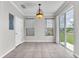 Dining area features tile floors, chandelier, and sliding glass door leading to the outdoors at 11617 Colony Lake Dr, Tampa, FL 33635