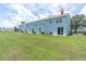 View of the rear of the property with sliding glass doors to the backyard at 11617 Colony Lake Dr, Tampa, FL 33635