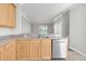 Open-concept kitchen features stainless steel dishwasher and sink with countertop space for meal preparation at 11617 Colony Lake Dr, Tampa, FL 33635