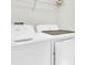 A convenient laundry room featuring a washer and dryer for easy chore completion at 11617 Colony Lake Dr, Tampa, FL 33635