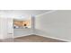 Spacious living room with wood floors and a kitchen view provides an open and inviting atmosphere at 11617 Colony Lake Dr, Tampa, FL 33635