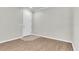 Bright, open living room with wood flooring and a white door at 11617 Colony Lake Dr, Tampa, FL 33635
