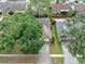 An aerial view of a single-Gathering home, including a driveway and mature landscaping surrounding the property at 11816 Cedarfield Dr, Riverview, FL 33579