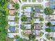 An aerial view of a residential neighborhood, showcasing single-Gathering homes with mature trees and landscaping at 11816 Cedarfield Dr, Riverview, FL 33579