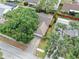 An aerial view of a single-Gathering home, showing the roof, driveway, and surrounding landscaping at 11816 Cedarfield Dr, Riverview, FL 33579