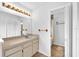 Bathroom featuring a large mirror, vanity with storage, and a shower-tub combination at 11816 Cedarfield Dr, Riverview, FL 33579