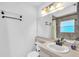 Bathroom featuring updated fixtures, vanity with sink, and shower with a window at 11816 Cedarfield Dr, Riverview, FL 33579