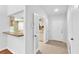 Open entryway providing a view of the kitchen and dining area at 11816 Cedarfield Dr, Riverview, FL 33579