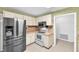 Well-lit kitchen featuring stainless steel appliances and light countertops at 11816 Cedarfield Dr, Riverview, FL 33579